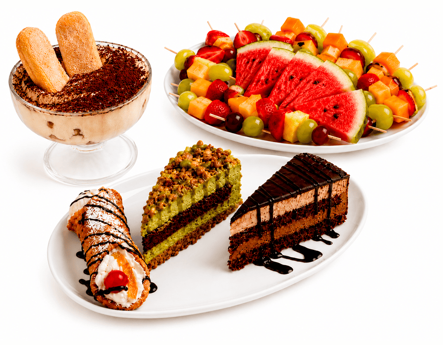 Selezione di tiramisù, cannolo, torte e frutta fresca servita su piatti bianchi.